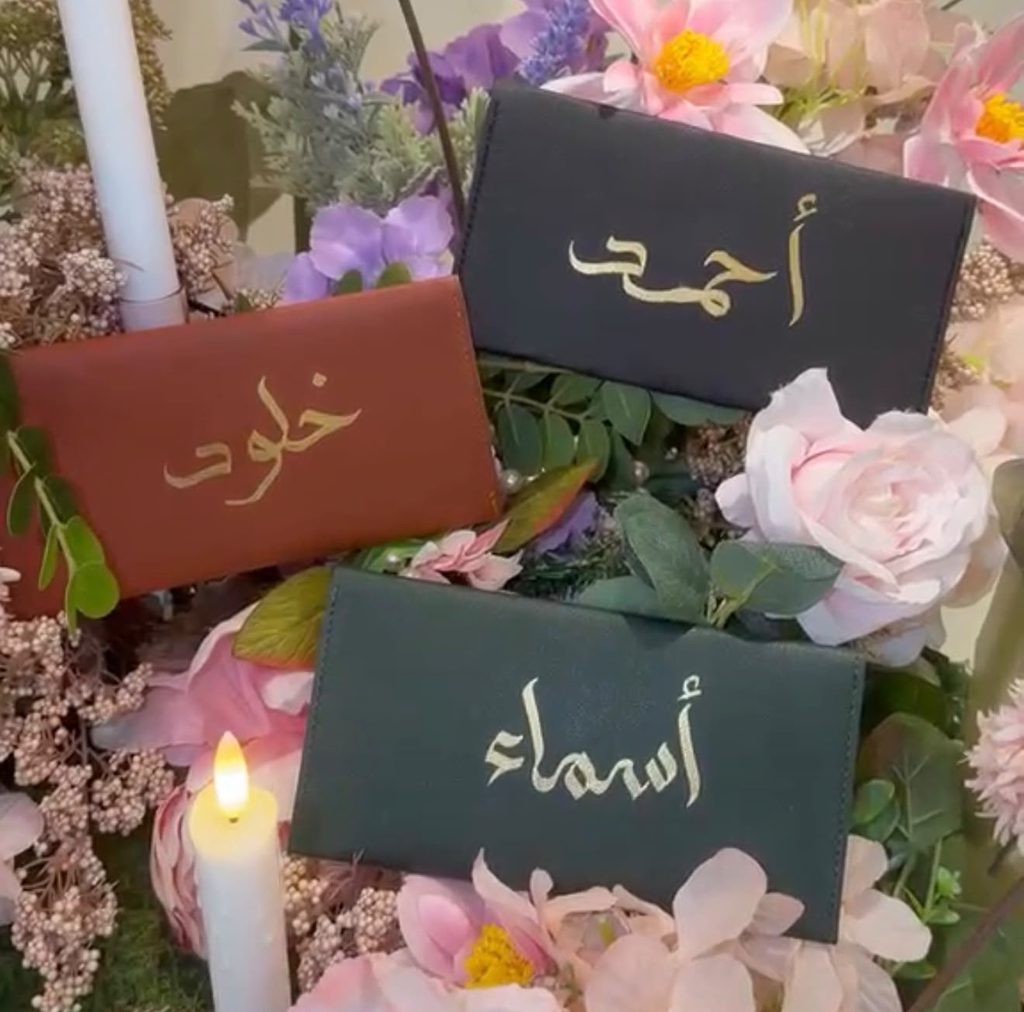 “Arabic calligraphy on personalised wedding favours in Dubai”.